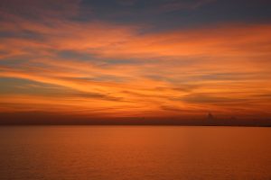 dramatic orange sunset over calm sea